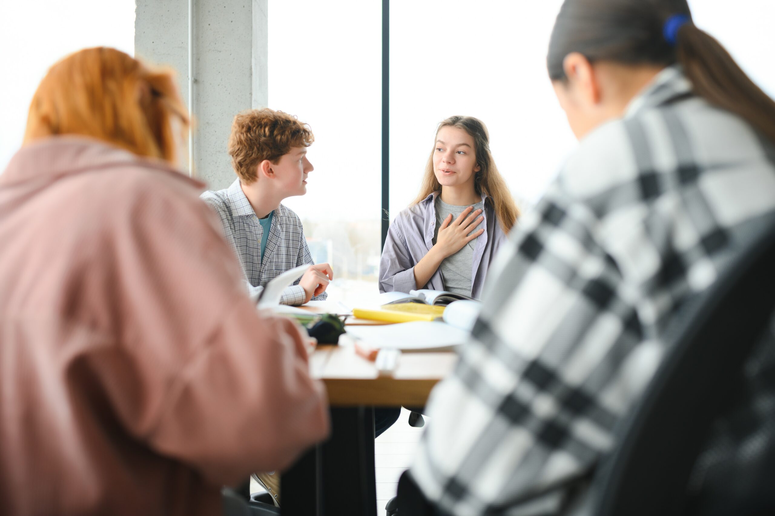 Group of college students doing homework