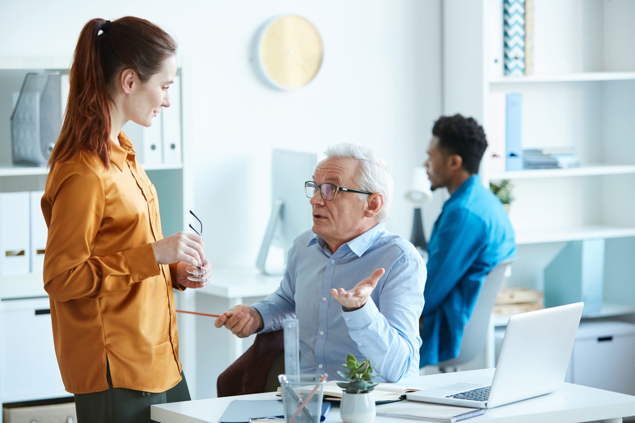 Male leader talking to employee